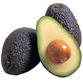 Three avocados from Dierbergs, one cut in half to show the pit, on a white background.