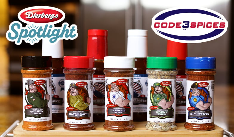 Dierbergs Spotlight image showing several containers of Code 3 Spices products including Top Gun Rub, Backdraft Rub, Rescue Rub, Grunt Rub and 5-0 Rub with the Code 3 Spices logo inset.